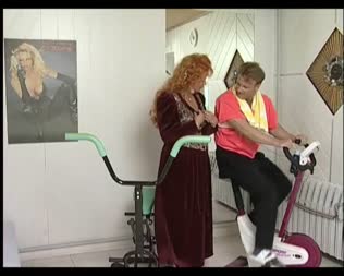 Horny Granny By Her Fitness Coach - This hot fat granny has a personal fitness coach who helps her to keep her body in a good shape. Today she gets some special training... She gets fucked at the exercise bike! Watch how her coach rubs her fat tits and how she sucks his hard cock. It ends with hardcore fucking a nice facial!